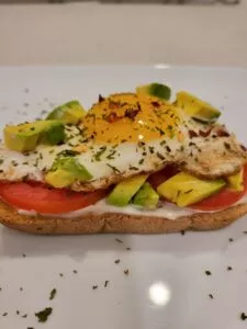 Breakfasr Avocado Toast with Sunny Side Up Egg